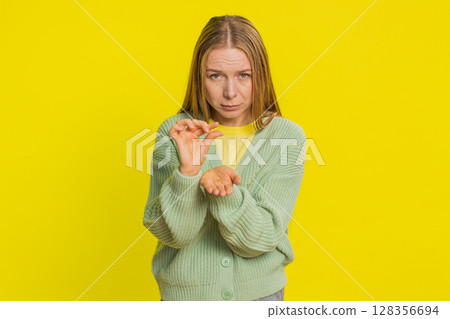 Woman show a little bit gesture begging help need some more please give me measuring small size 128356694