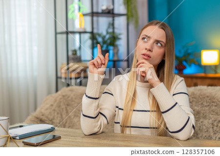 Caucasian woman deep in thought at home, hand on chin, looking aside, pondering a solution decisions Caucasian woman deep in thought at home, hand on chin, looking aside, pondering a solution decisions 128357106