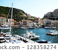 Scenic View of Bonifacio Port in Corsica with Luxury Yachts and Cliffside Town Experience the charm of the French island of Corsica with this stunning image capturing the picturesque port of Bonifacio 128358274