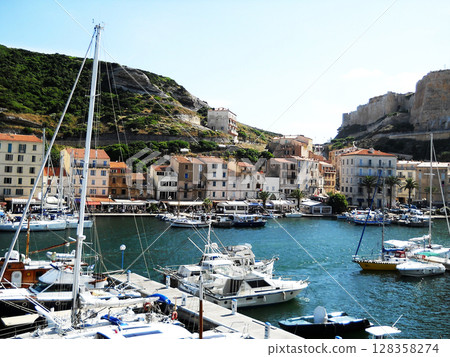 Scenic View of Bonifacio Port in Corsica with Luxury Yachts and Cliffside Town Experience the charm of the French island of Corsica with this stunning image capturing the picturesque port of Bonifacio Scenic View of Bonifacio Port in Corsica with Luxury Yachts and Cliffside Town Experience the charm of the French island of Corsica with this stunning image capturing the picturesque port of Bonifacio 128358274