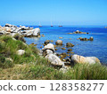 Turquoise Waters of the Mediterranean Sea Near Lavezzi Island, Corsica This stunning image captures the untouched beauty of the Mediterranean Sea near Lavezzi Island, off the southern coast of Corsica 128358277