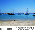 Crystal-Clear Waters and Yachts off Lavezzi Island, Corsica. This breathtaking aerial or coastal view captures the idyllic beauty of Lavezzi Island, nestled in the Strait of Bonifacio between Corsica 128358278