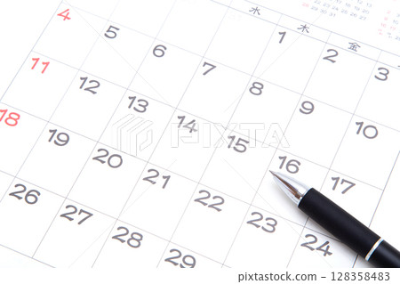 Calendar and ballpoint pen Calendar and ballpoint pen 128358483