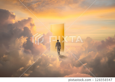 A door of light appears in the clouds ─ A silhouette walking into a fantastical world and skyscape / A door to heaven / A door to reincarnation in another world A door of light appears in the clouds ─ A silhouette walking into a fantastical world and skyscape / A door to heaven / A door to reincarnation in another world 128358547