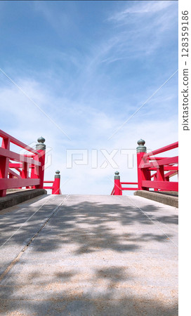 Red bridge leading to the sky 128359186