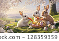 Three rabbits, one white, one brown, and one gray, are sitting in a vibrant spring meadow surrounded by flowers and decorated eggs, happily nibbling on carrots while enjoying the sunny weather. 128359359