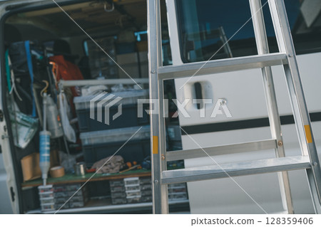 Air conditioner installation company's work vehicle 128359406