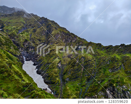 Majestic Snow-Capped Mountain Vista 128359620
