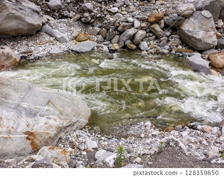 Mountain Stream with Clear Water Flowing Over Rocks Mountain Stream with Clear Water Flowing Over Rocks 128359650