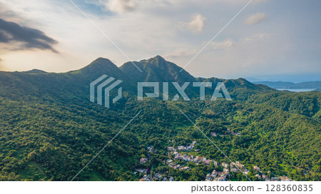 July 5 2025 View of Lush Green Hills and a Small Town Below July 5 2025 View of Lush Green Hills and a Small Town Below 128360835
