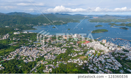 July 5 2025 Urban Landscape Overlooking Mountains and a Serene Coastal View 128360836