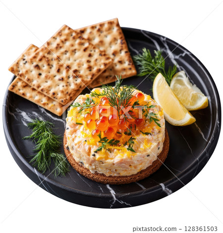 Smoked Trout Mousse Piped into Delicate Cone with Trout Roe, Dill Fronds, Lemon Zest, and Crisp Rye Cracker 128361503