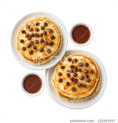 Fluffy Chocolate Chip Pancakes Served with Rich Syrup in White Plates, Perfect for Breakfast or Brunch 128361657