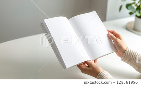 Woman looking at a book Woman looking at a book 128361950
