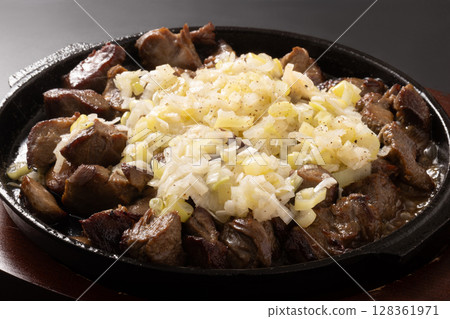 Beef tongue, cut-off pieces, green onion and salt Beef tongue, cut-off pieces, green onion and salt 128361971