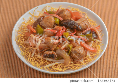 Meatball and vegetable udon noodles 128362173