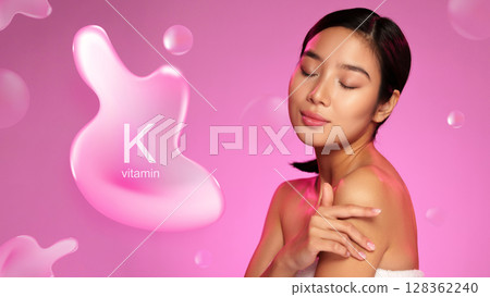 Woman applying skin care product featuring vitamin K with a pink background highlighting its benefits for skin health 128362240