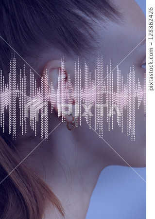 Sound wave visualization overlaid on the side profile of a woman with a ponytail in a serene setting Sound wave visualization overlaid on the side profile of a woman with a ponytail in a serene setting 128362426