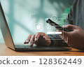 Close-up of two-factor authentication login screen on mobile and laptop. Concept of user security, identity verification, and online business access protection. 128362449