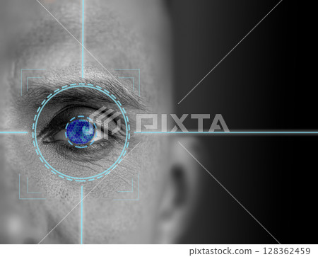 Close up view of human eye with digital targeting crosshair overlay showcasing biometric technology 128362459