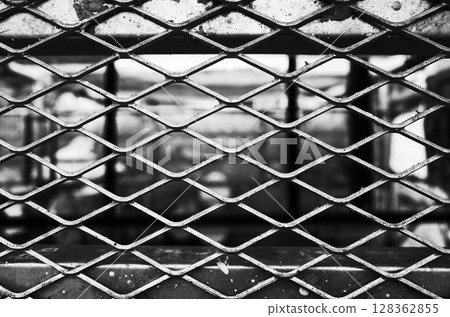 Wire mesh at a construction site, monochrome 128362855