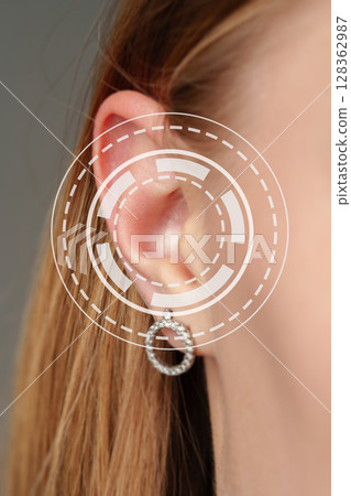 Close-up view of an elegant earring displayed in a contemporary studio setting during a fashion showcase 128362987