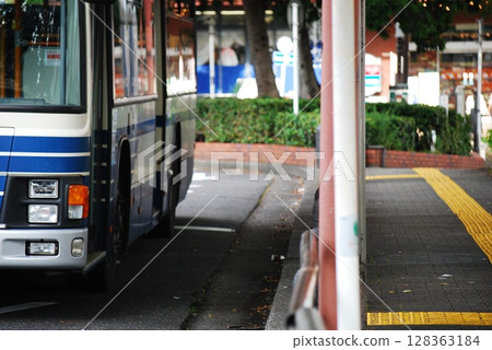 City bus stopping at a bus stop 128363184