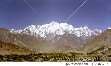 Karakorum range / A panoramic view of the snow-capped Karakorum range from the Pakistan border 128363704