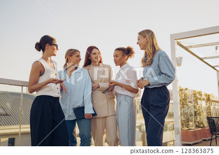 Empowered Women Networking on a Rooftop as part of a larger initiative to inspire and unify 128363875