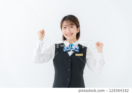 Young woman in uniform, business, fist pump Young woman in uniform, business, fist pump 128364182
