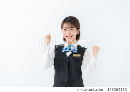 Young woman in uniform, business, fist pump Young woman in uniform, business, fist pump 128364183