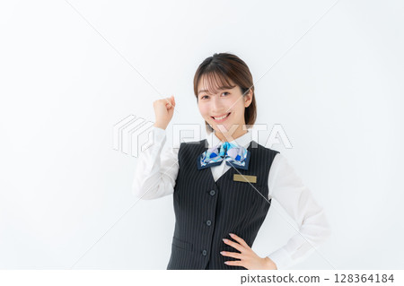 Young woman in uniform, business, fist pump Young woman in uniform, business, fist pump 128364184