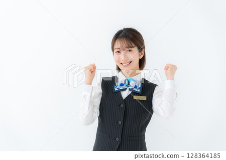 Young woman in uniform, business, fist pump Young woman in uniform, business, fist pump 128364185