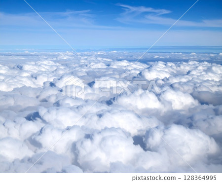 The sea of clouds seen from an airplane 128364995
