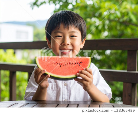 Summer vacation: boy eating watermelon 128365489