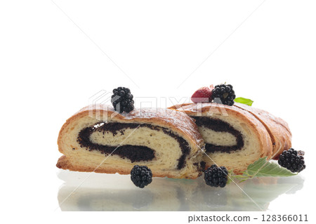 Yeast dough pastries with poppy seeds and powdered sugar, on a white background Yeast dough pastries with poppy seeds and powdered sugar, on a white background 128366011