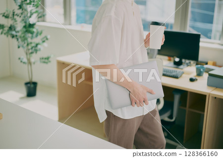 Young man doing desk work Young man doing desk work 128366160