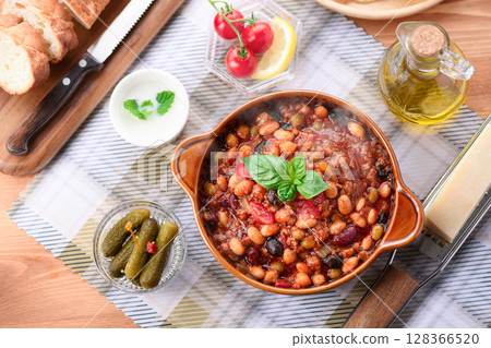 A colorful Western-style table with lots of ingredients and chili con carne A colorful Western-style table with lots of ingredients and chili con carne 128366520