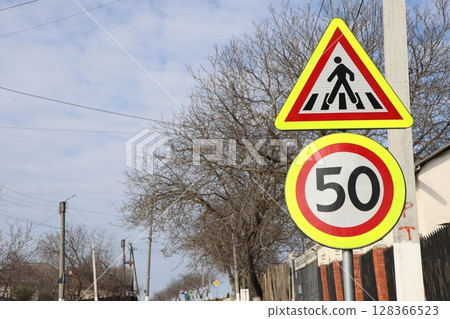 Traffic Signs Indicating the Presence of Pedestrian Crossings and Speed Limitations Traffic Signs Indicating the Presence of Pedestrian Crossings and Speed Limitations 128366523