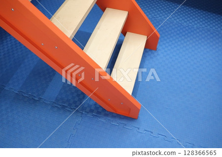 Colorful and Playful Stairs Designed Specifically for Children in an Indoor Playground Setting 128366565