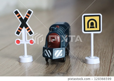 This Vintage Train Toy features Warning Signs, making it a delightful choice for kids This Vintage Train Toy features Warning Signs, making it a delightful choice for kids 128366599