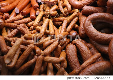 A beautiful variety of sausages and assorted meats are displayed together in harmony 128366653