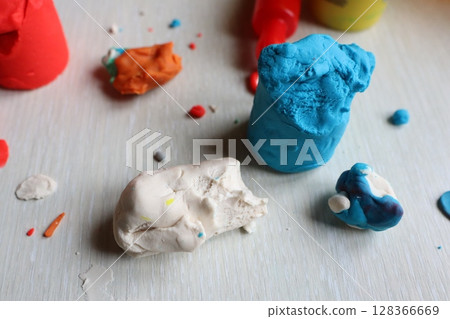 A Variety of Colorful Art Supplies Spread Out on a Wooden Surface for Creative Projects 128366669