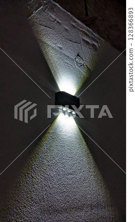 A Stylish Wall Light featuring a Modern Design that enhances the beauty of any space 128366893