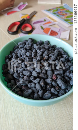 A Bowl Filled with Fresh Blueberries Placed Against a Creative and Artistic Background A Bowl Filled with Fresh Blueberries Placed Against a Creative and Artistic Background 128366917