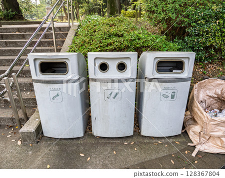 Separated trash bins in the park Separated trash bins in the park 128367804
