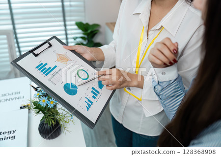 Business Meeting with Data Analysis and Strategy Planning in Modern Office Environment 128368908