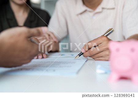 Couple Planning Savings and Banking with Financial Advisor, Discussing Budget and Investment Strategies 128369141