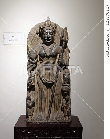 Statue of Kishimojin Hariti on display at the Peshawar Museum in Pakistan 128370217
