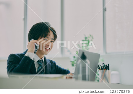 Man working in suit 128370276
